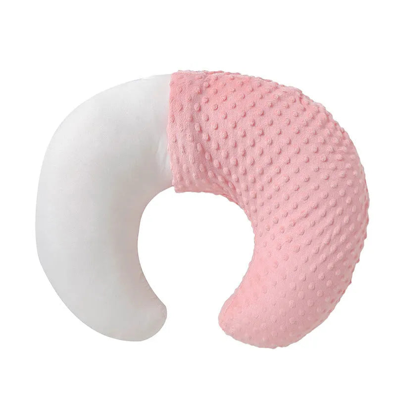 Nursing pillow with removable cover in light blue, featuring a built-in milk spilt preventer.