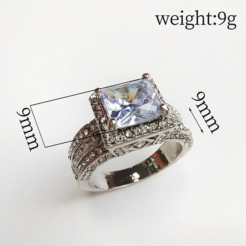 Geometric women's alloy ring in gold or white on a UK ring size chart showing sizes 5 to 13.