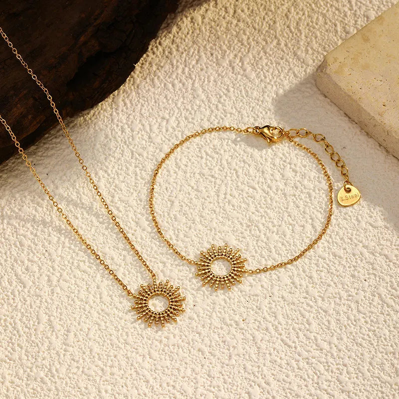 Sunflower Series gold tone geometric chain necklace and bracelet set for women.