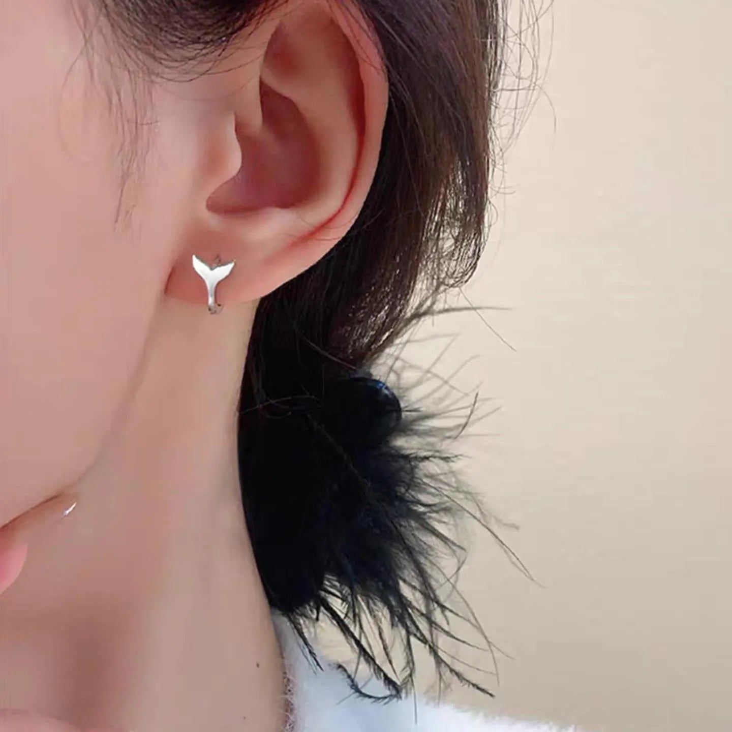 Women's fishtail design earrings in electroplated copper with gold colour finishes
