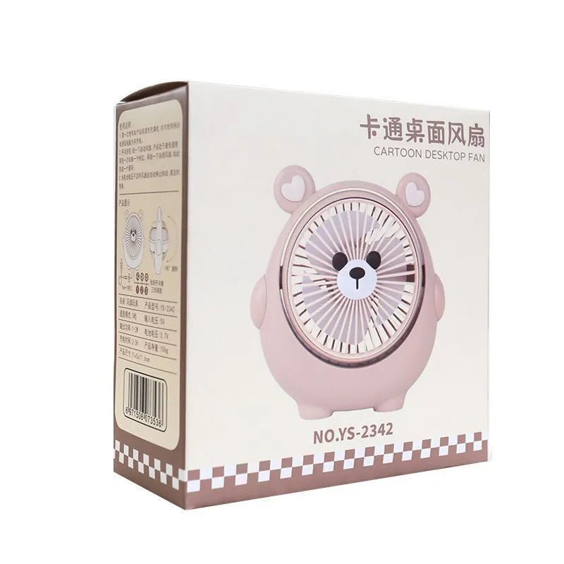 Small plastic desktop fan with a cute dog design, showing USB port and control buttons.