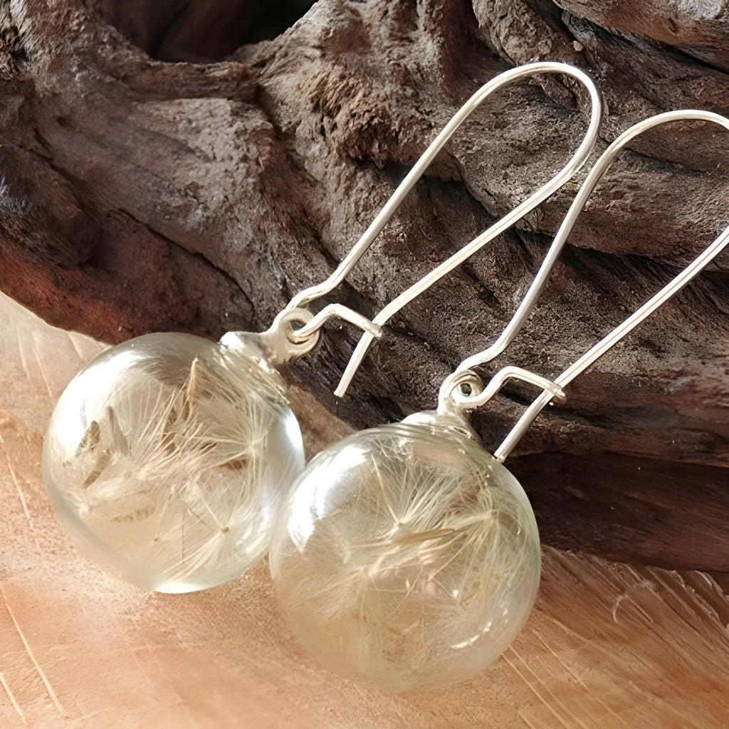 Transparent glass ball earrings with dandelion seed crystal design in silver French hooks