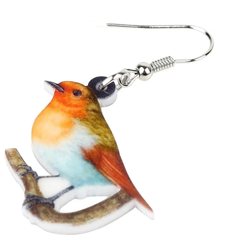 Blue Titmouse and snake motif acrylic drop earrings with geometric pendant shape on a white background.