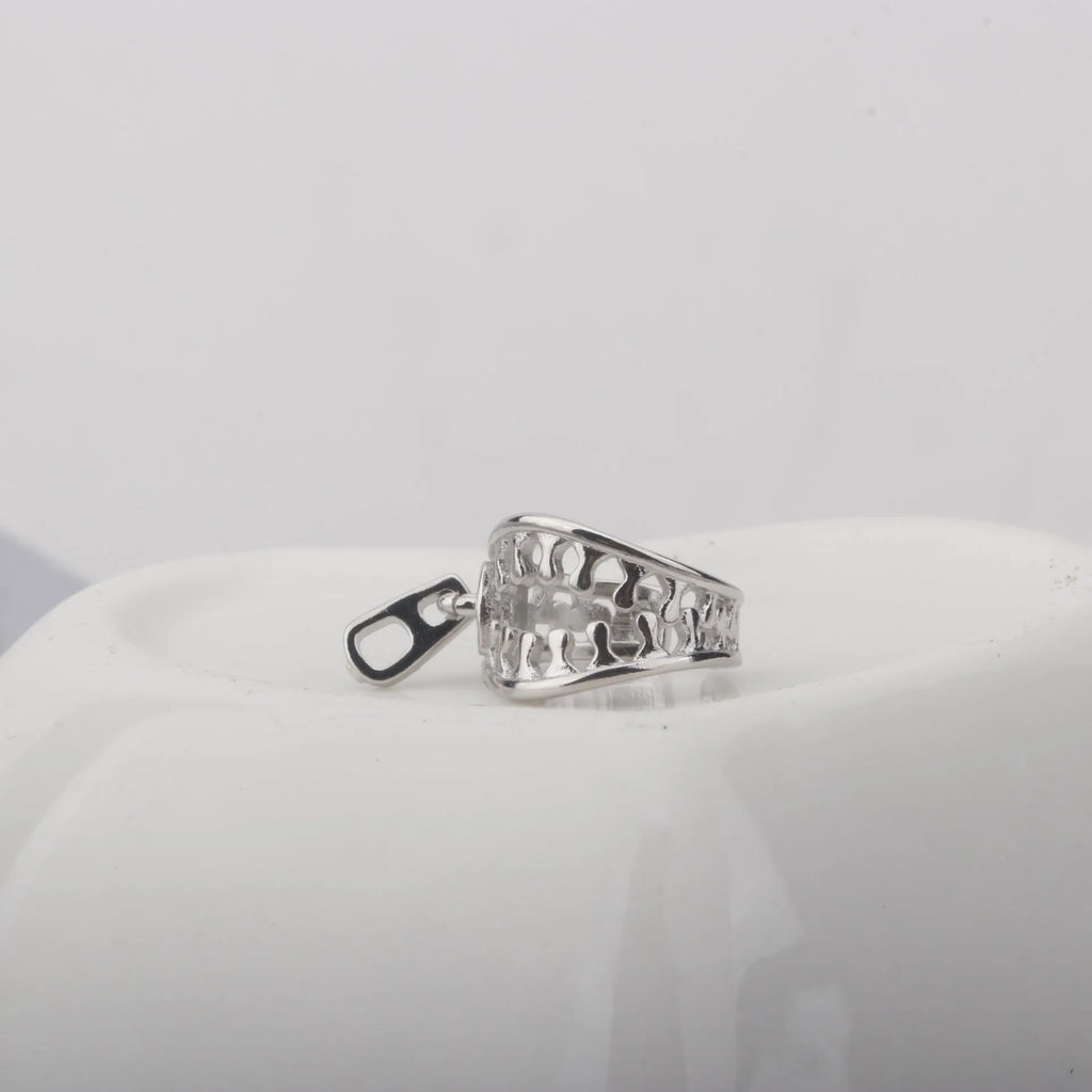 A pair of simple geometric copper clip-on earrings in colour ES862 with a linear pattern design.