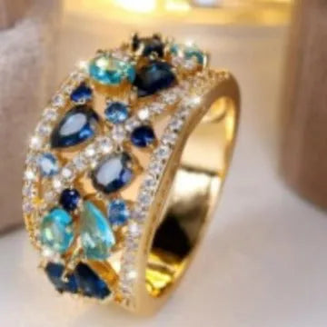 Women's round hollow fashion ring in copper with a choice of gemstone colours on a size chart.