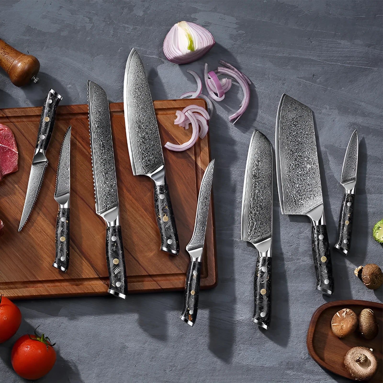 Eight-piece Damascus steel kitchen knife set showing fishbone pattern blades on a wooden surface.