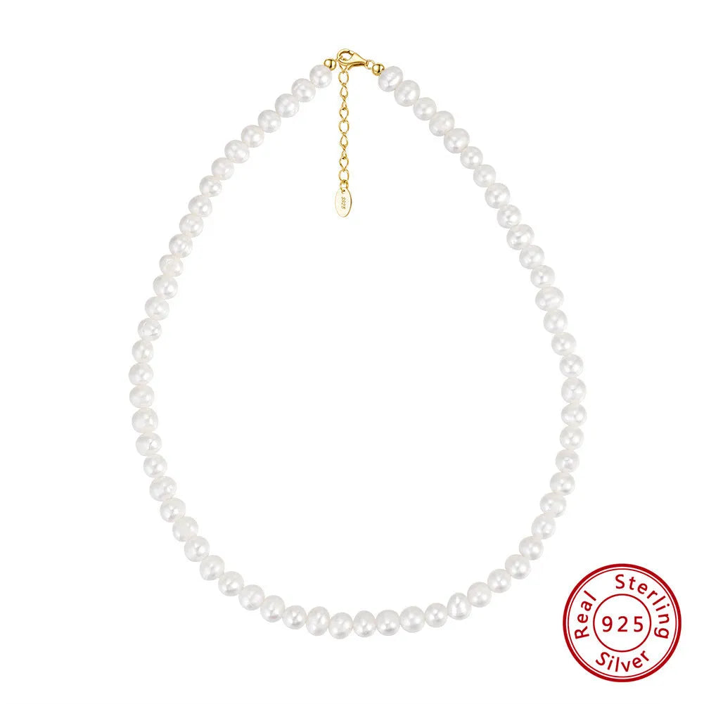 Women's silver necklace with a single round freshwater pearl and adjustable lobster clasp.