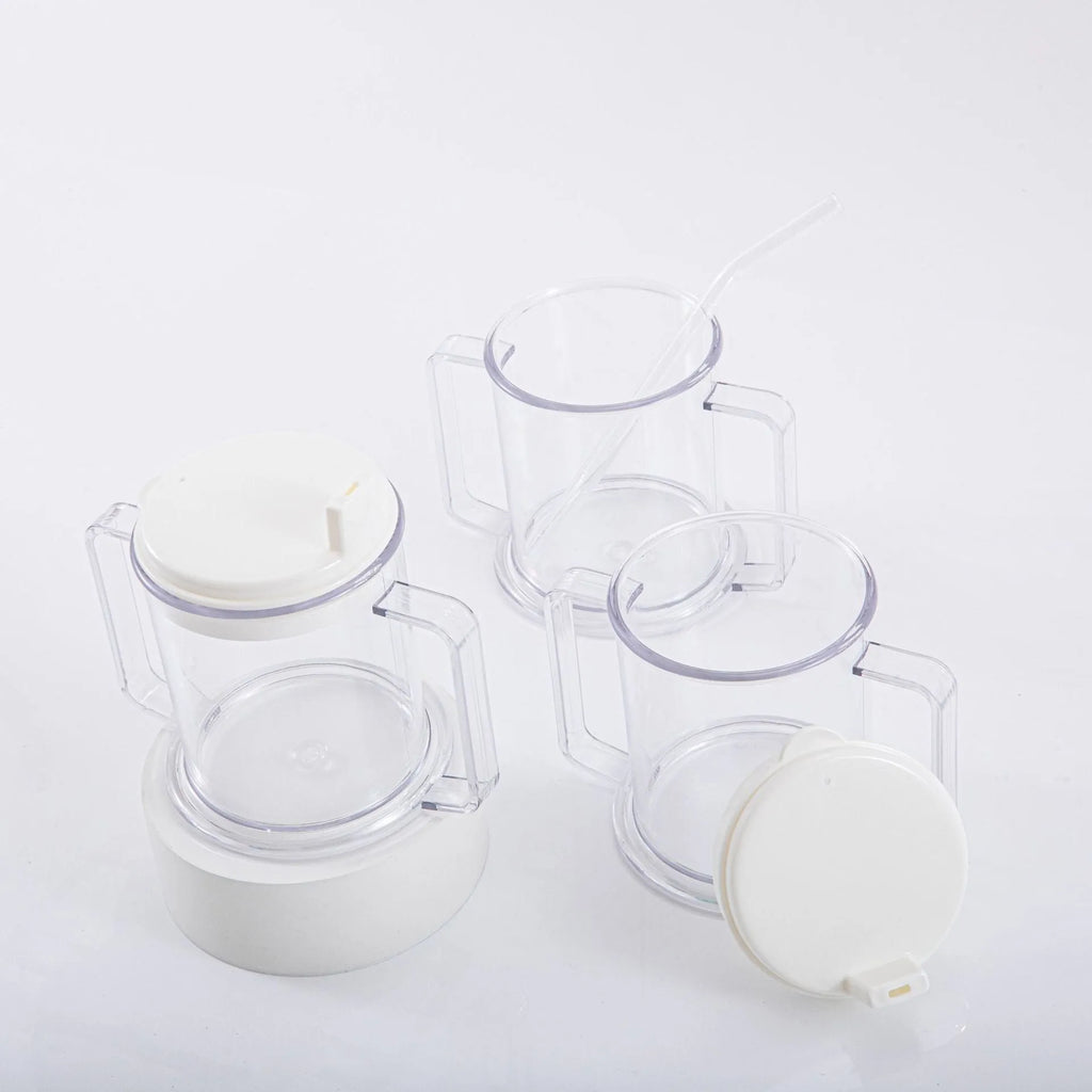 Transparent plastic spill-proof drinking cup on a table