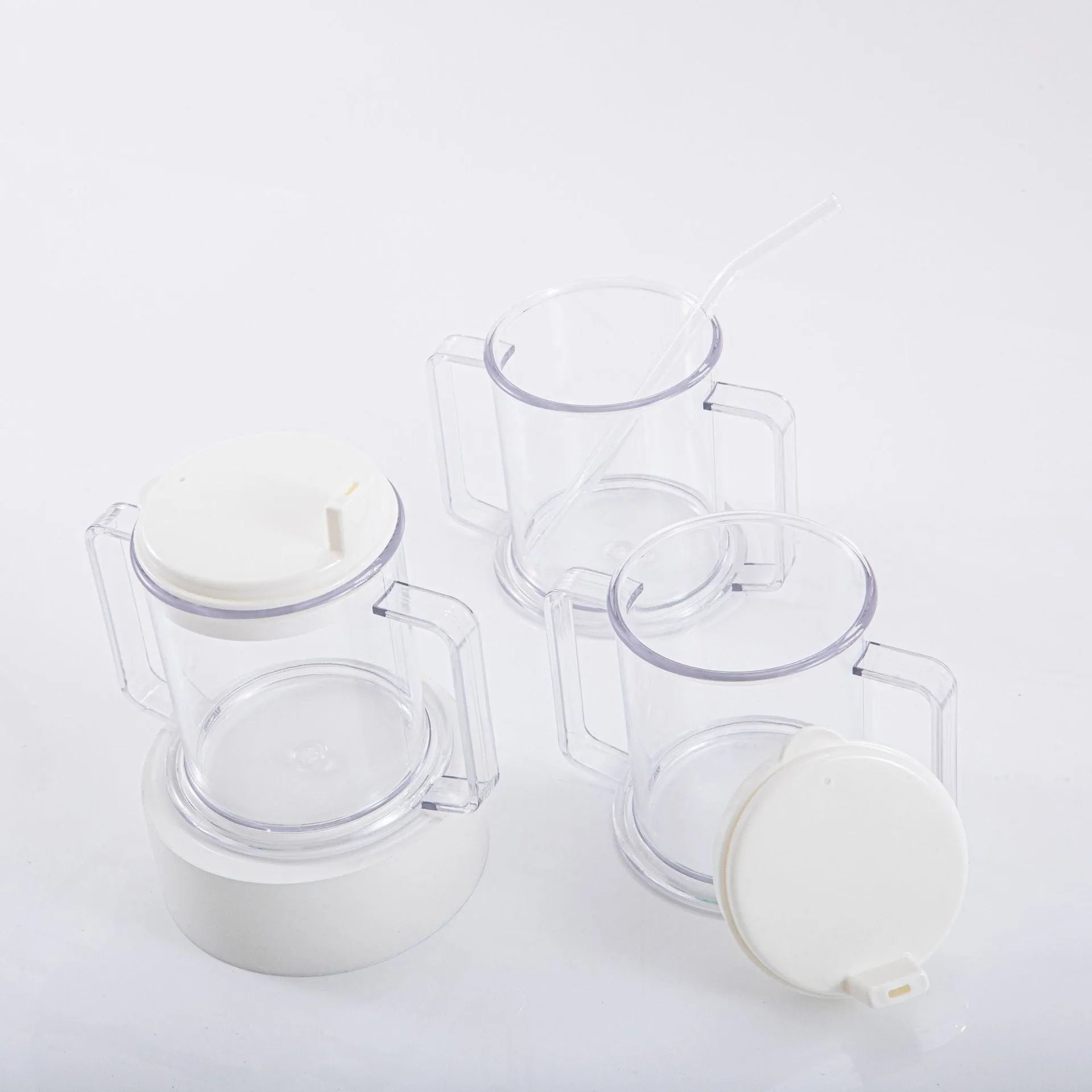 Transparent plastic spill-proof drinking cup on a table