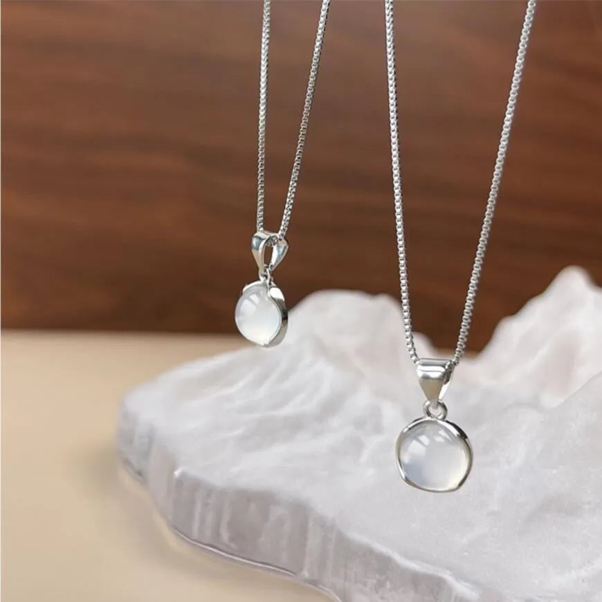 Women's silver-tone adjustable necklace with a clear oval crystal star pendant on a box chain.