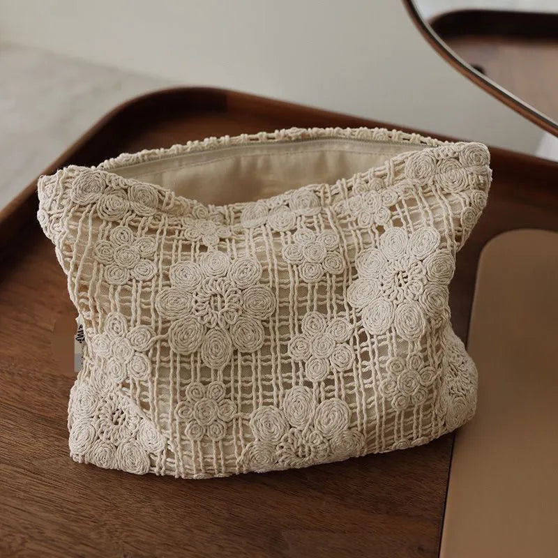 Handmade crocheted hollow flower cosmetic bag with ethnic embroidery on solid colour corduroy fabric
