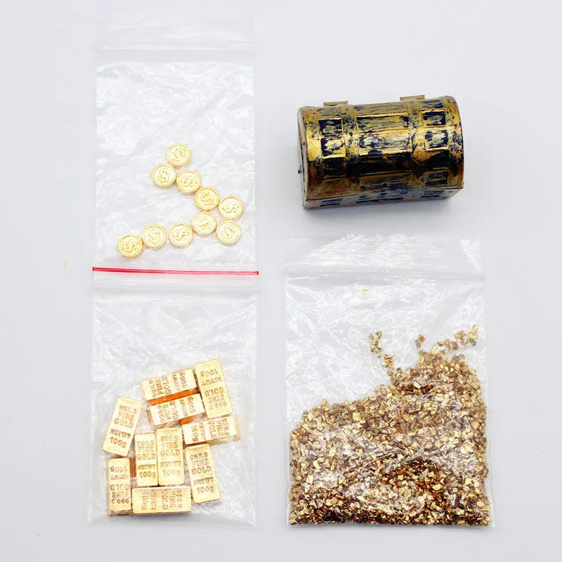 Alloy gold coin and bar treasure chest miniature doll house accessory on display.