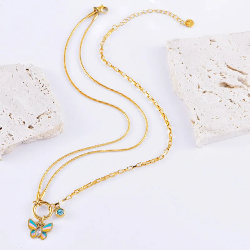 Gold titanium steel butterfly necklace and bracelet jewellery set with animal modelling details