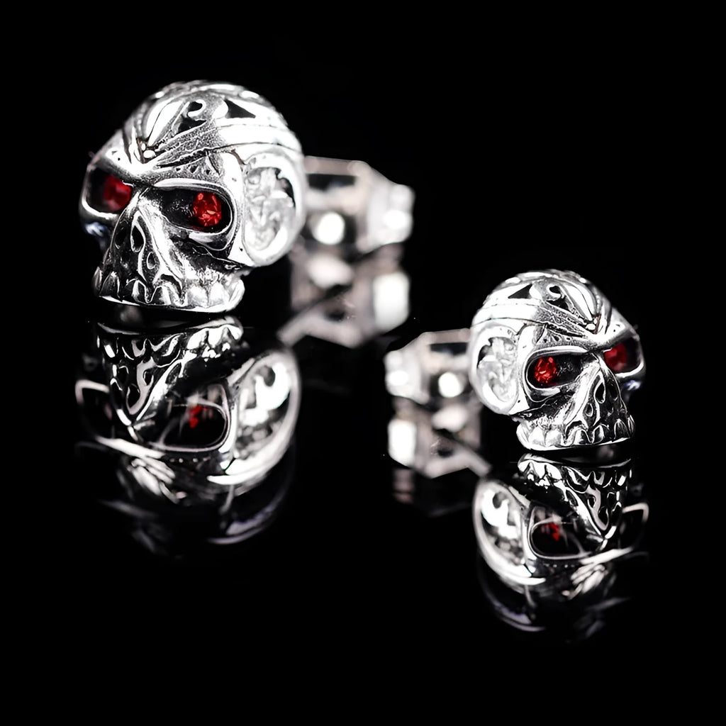 Retro skull stud earrings with red eye detailing on alloy metal with electroplated finish