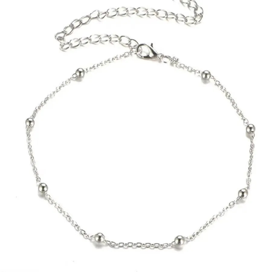 Women's metal anklet with geometric pendant on twisted chain