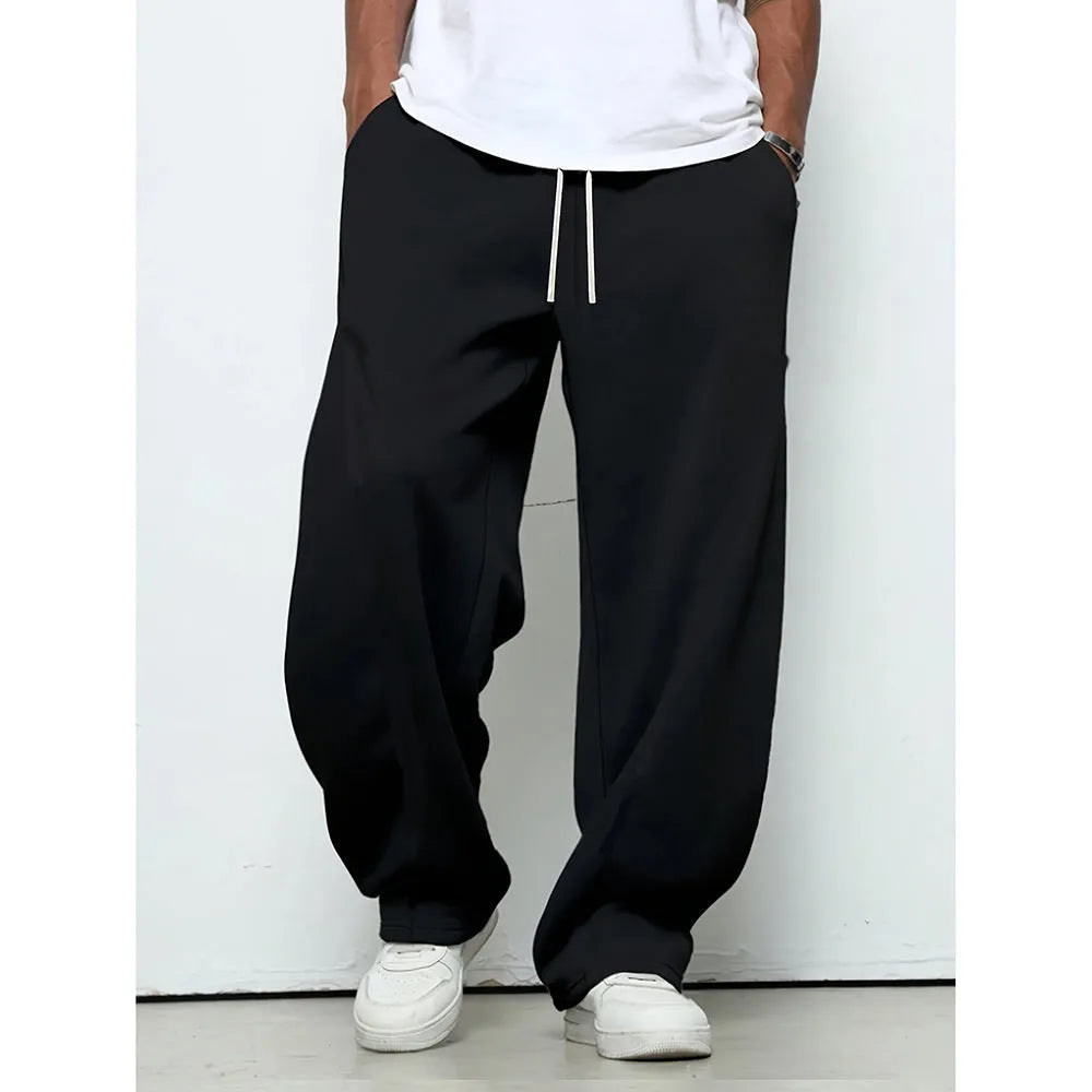 Men's solid colour polyester trousers with straight leg and drawstring waist in black, dark grey, light grey