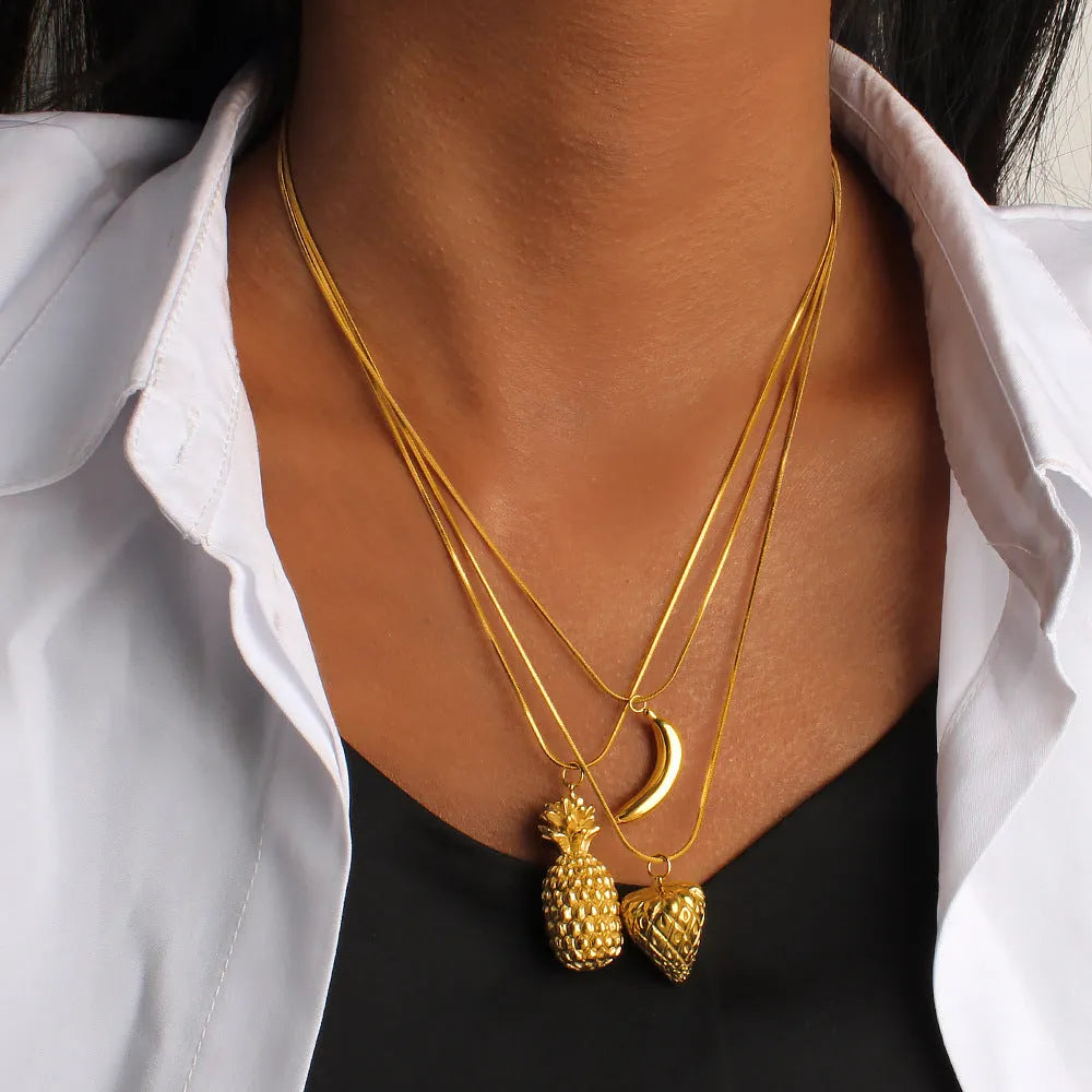 Stainless steel women's necklace with a small colourful fruit pendant on a regular chain.