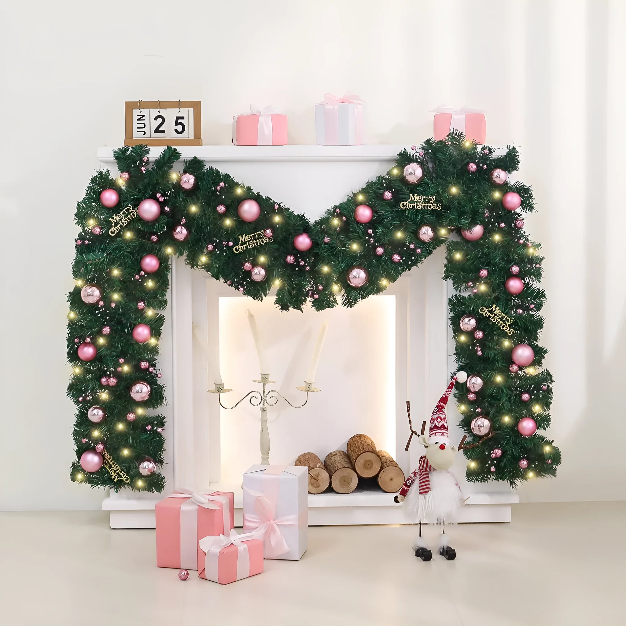 2.7 metre long pink Christmas rattan decoration with 240 decorative heads draped on a mantelpiece