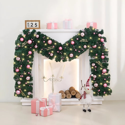 2.7 metre long pink Christmas rattan decoration with 240 decorative heads draped on a mantelpiece