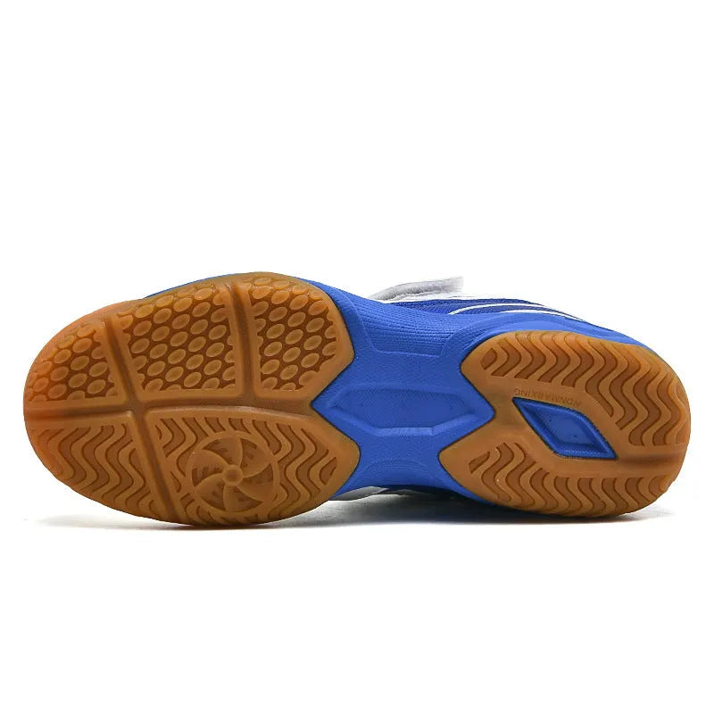 White and blue PVC low-top badminton shoes with hand-painted detail and a ribbed sole.