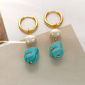 A set of two pairs of women's ear clips: one short and one dangle style, with geometric copper design, turquoise, and cultured pearls.