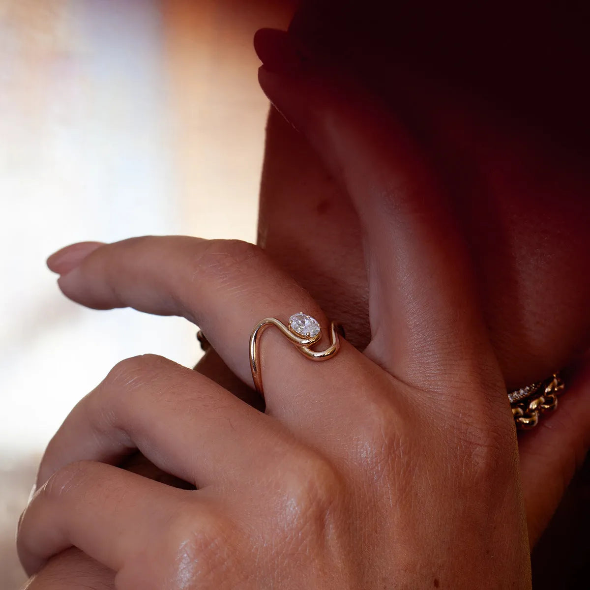 Men's geometric zircon ring in titanium steel on a grey background.