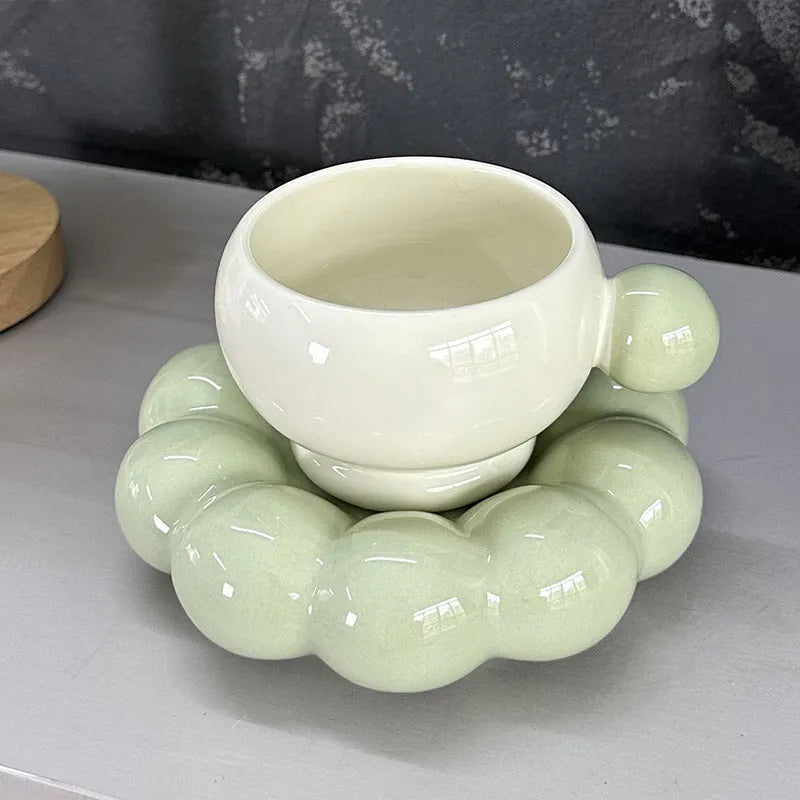 Ceramic coffee cup and saucer set in a simple Nordic design, shown in a choice of colours.