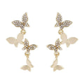 Gold tone butterfly drop earrings with copper construction for women