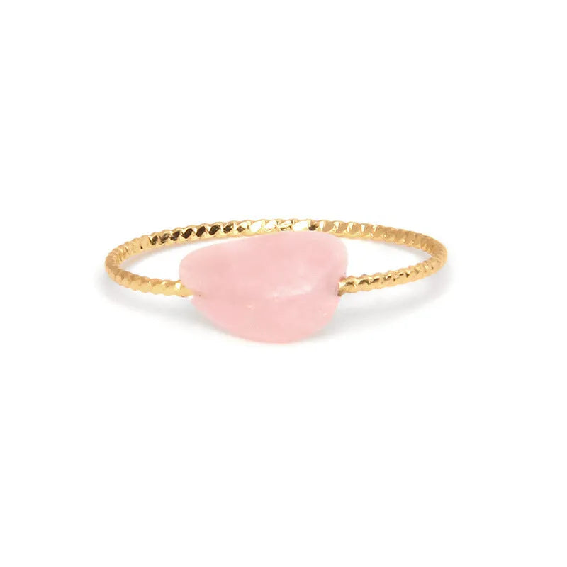 Original geometric design women's ring in coloured agate stone on a plain background.