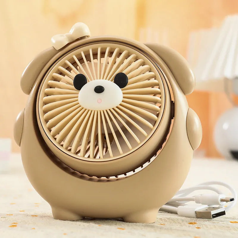 Small plastic desktop fan with a cute dog design, showing USB port and control buttons.