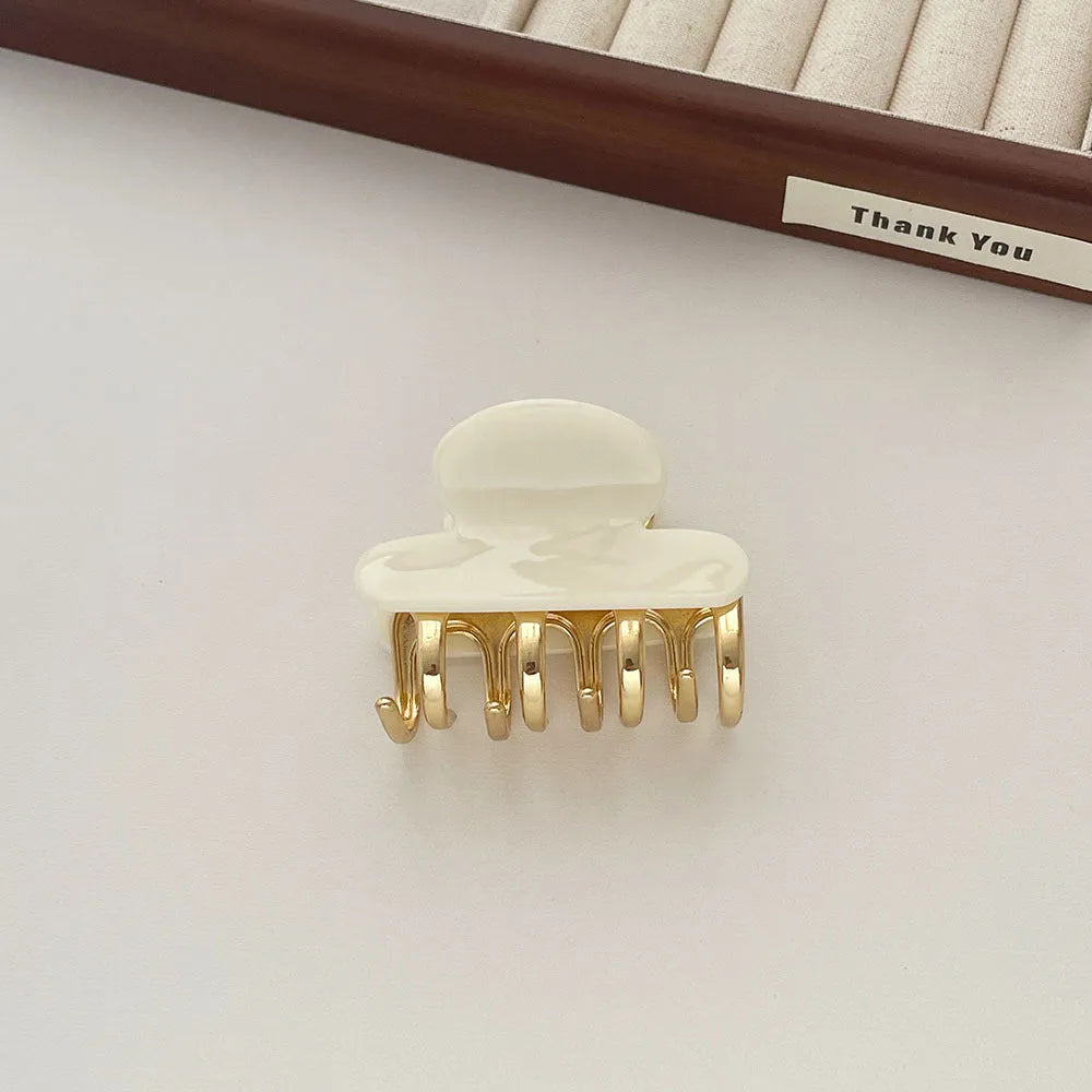 Women's hair barrettes with metal grip in alloy acrylic showing four colour options