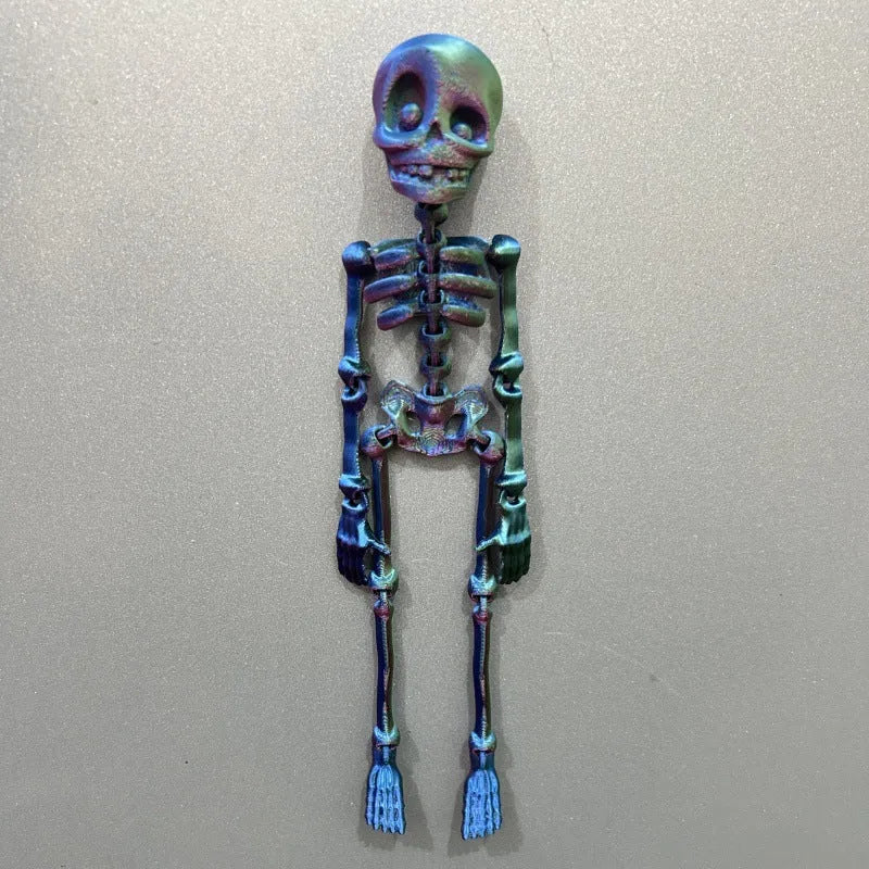 3D printed white skull refrigerator magnet with intricate details on a metallic surface.