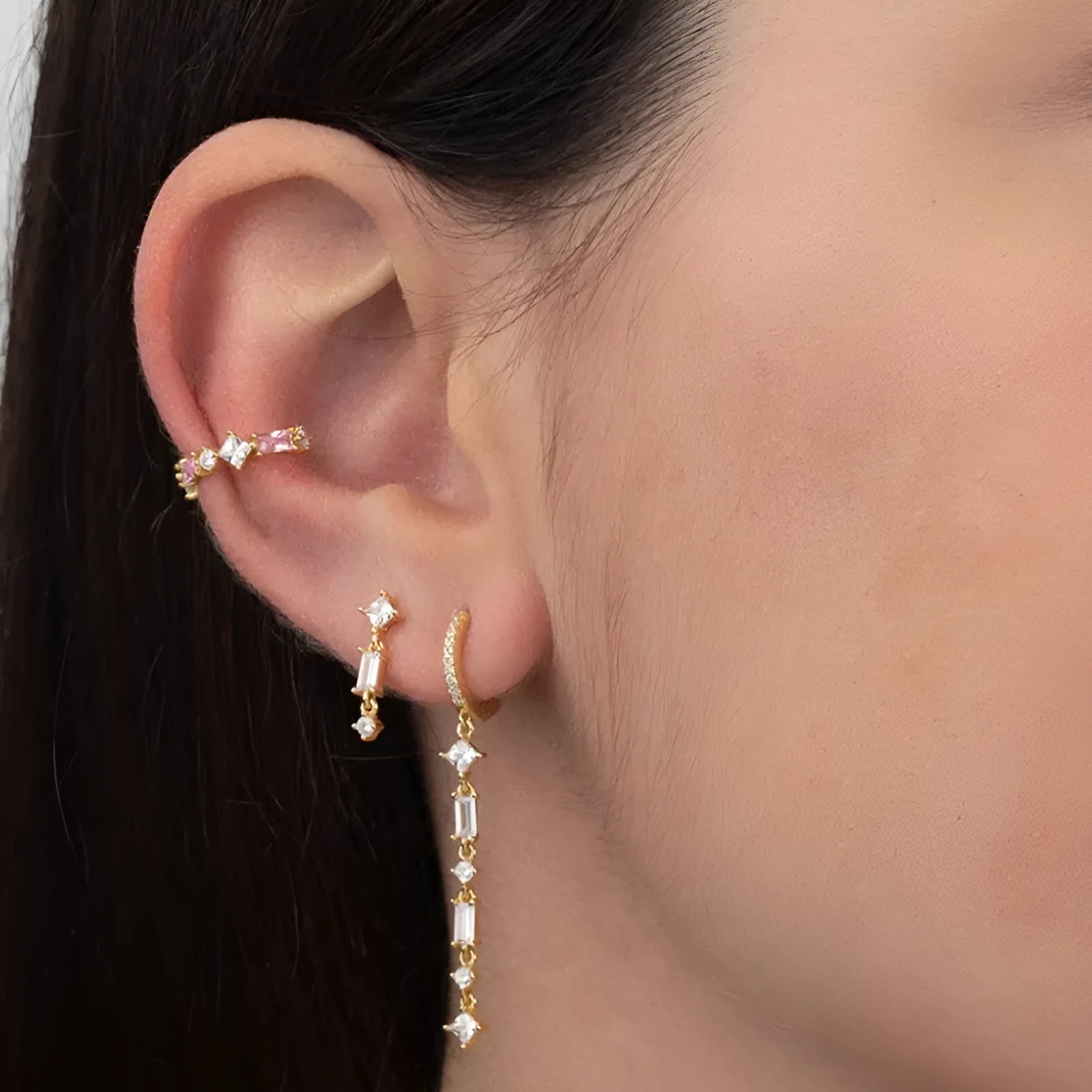 Geometric U-shaped silver tassel ear clip with micro-inlaid colourful zircon stones and dot, ring, and line details.