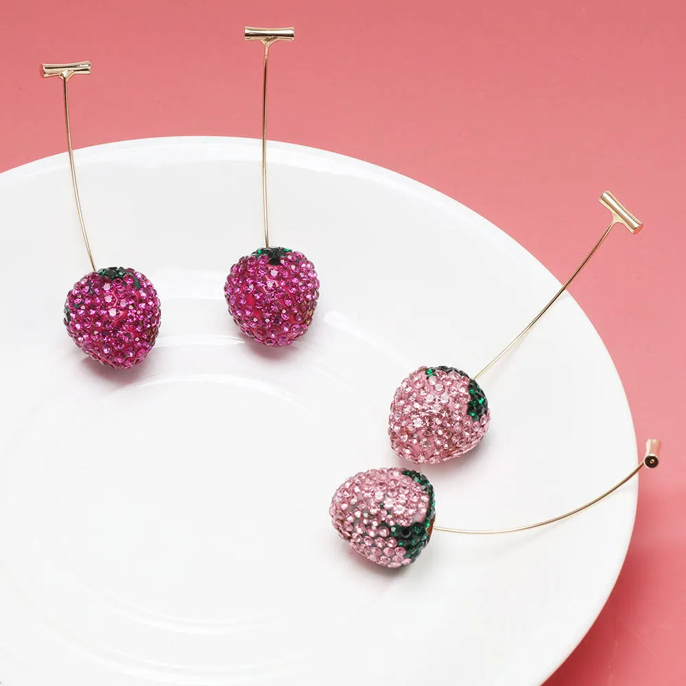 Geometric red strawberry stud earrings with spot drill texture on a zinc alloy post.