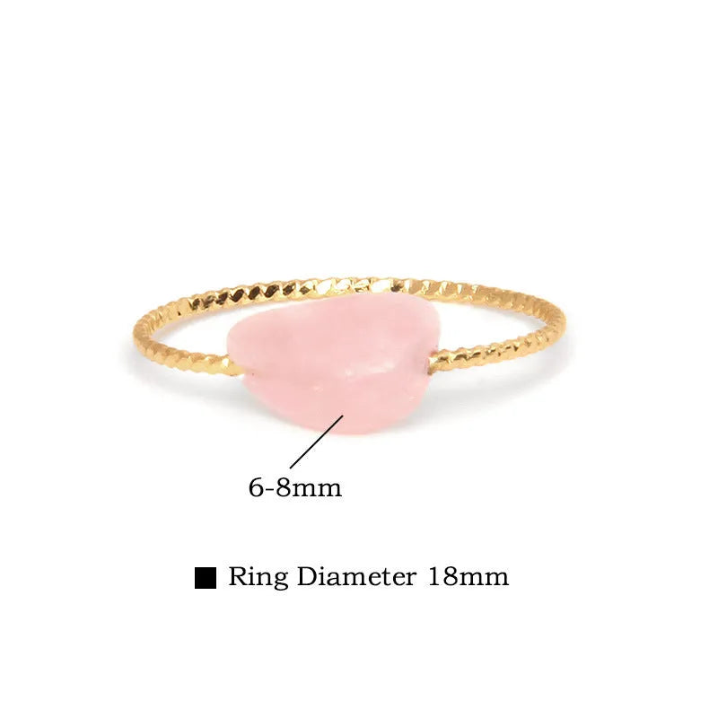 Original geometric design women's ring in coloured agate stone on a plain background.