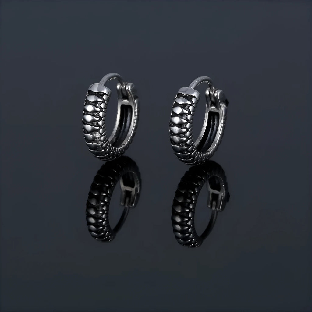 Geometric retro twist stainless steel earrings with circular sports style element in silver
