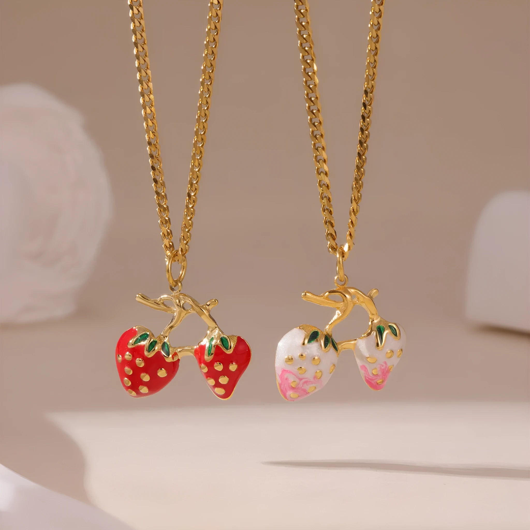 Stainless steel strawberry pendant necklace on an alloy chain in red or white powder gradient.