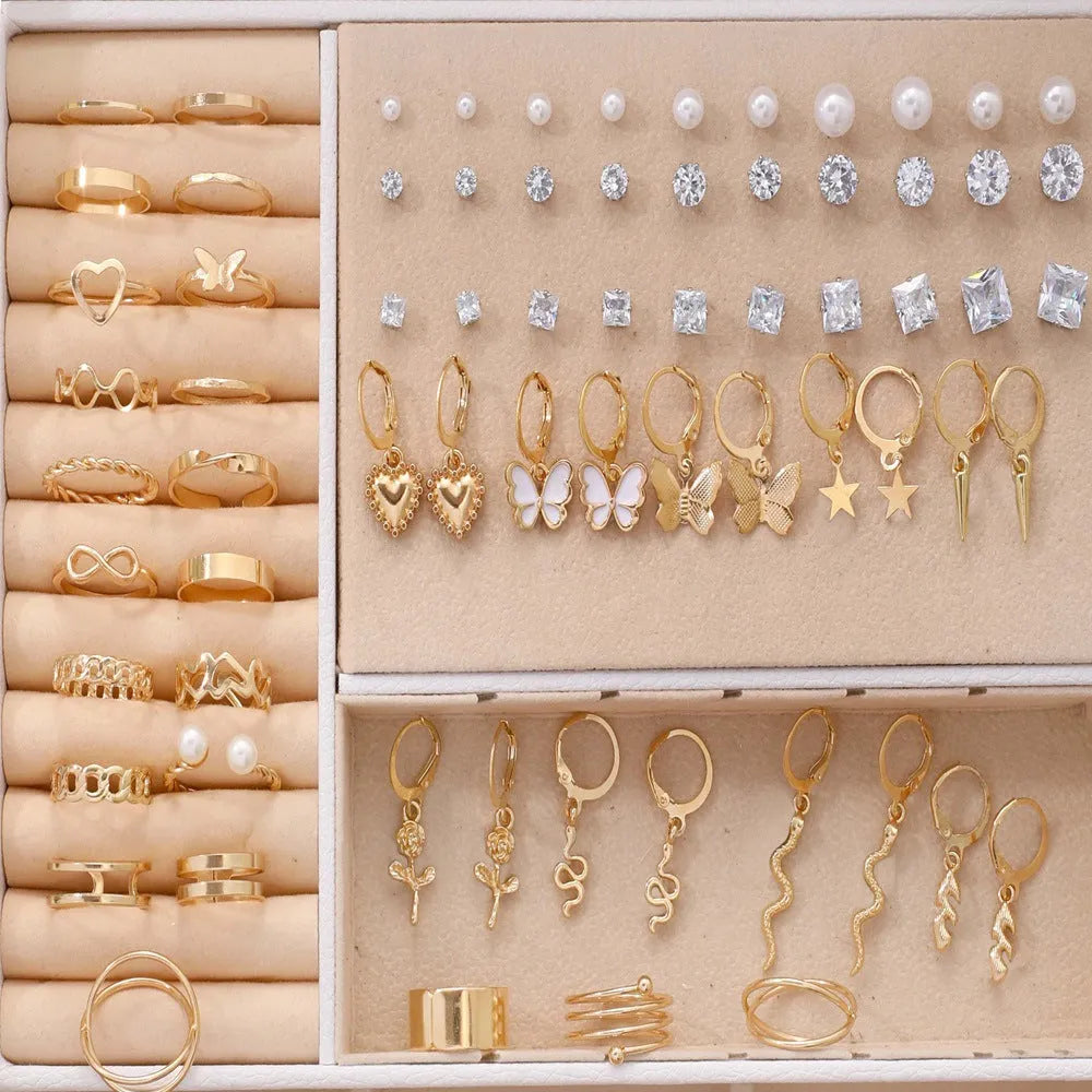108-piece assortment of gold and yellow alloy stud earrings with geometric shapes and round pearls.