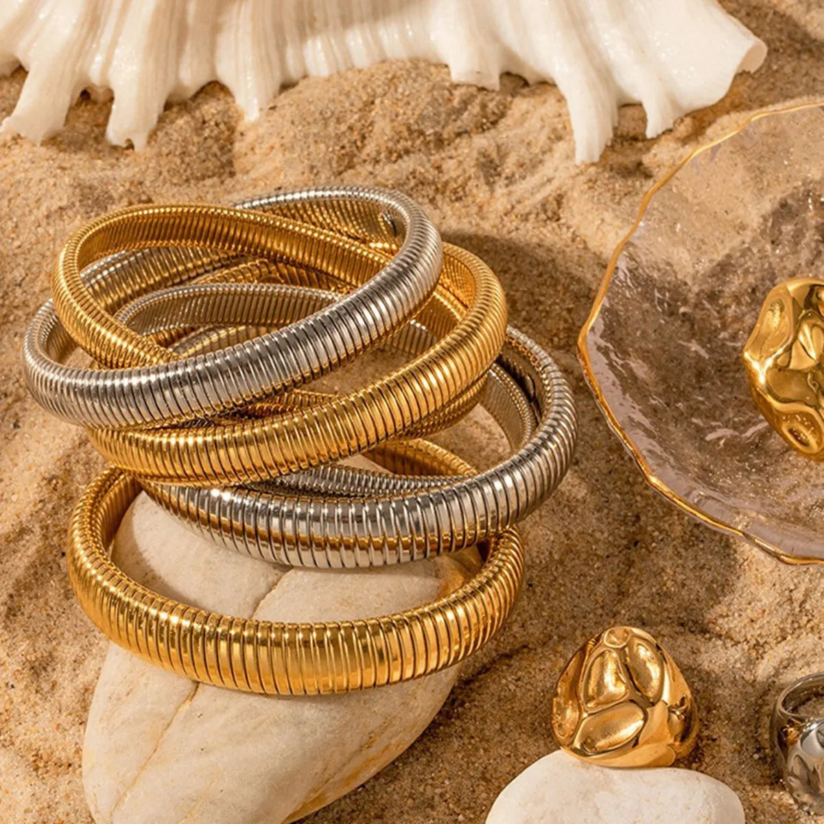 Women's titanium steel elastic bracelet with vertical stripe ring pattern in gold finish
