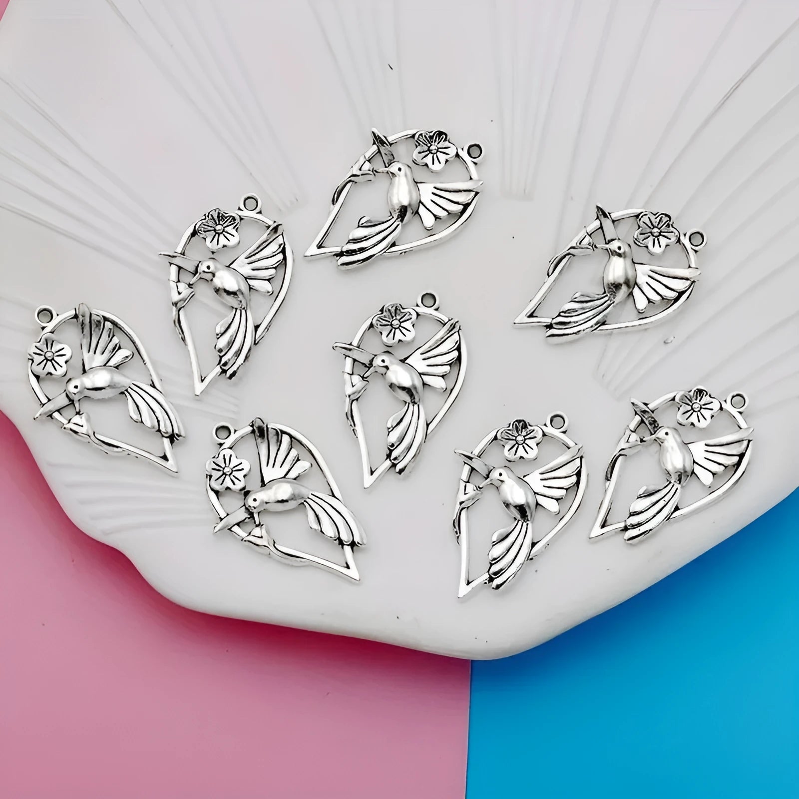 Gold-tone alloy magpie pendant charm for DIY jewellery making on a white background.