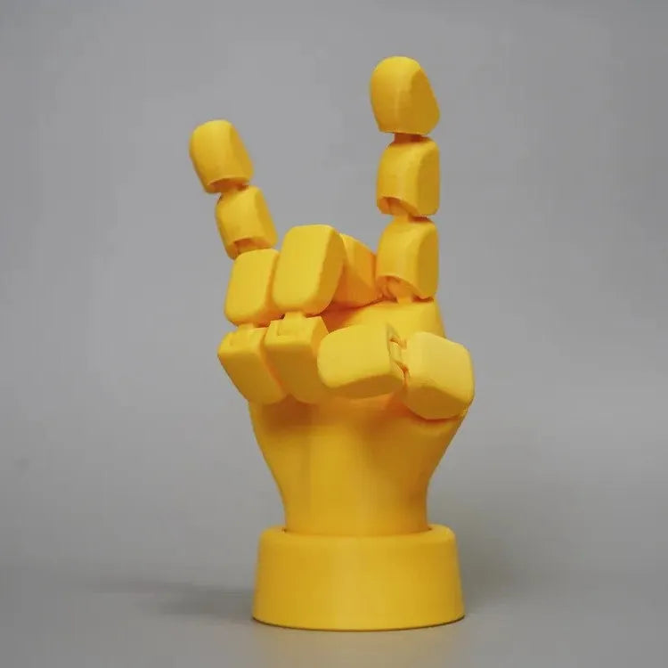 Yellow movable joint hand ornament figurine made from PLA plastic for decorative display.