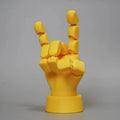 Yellow movable joint hand ornament figurine made from PLA plastic for decorative display.
