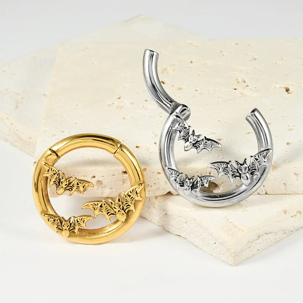 A pair of fashion earrings with a raised totem pattern, made from stainless steel in one of 15 available colour finishes.