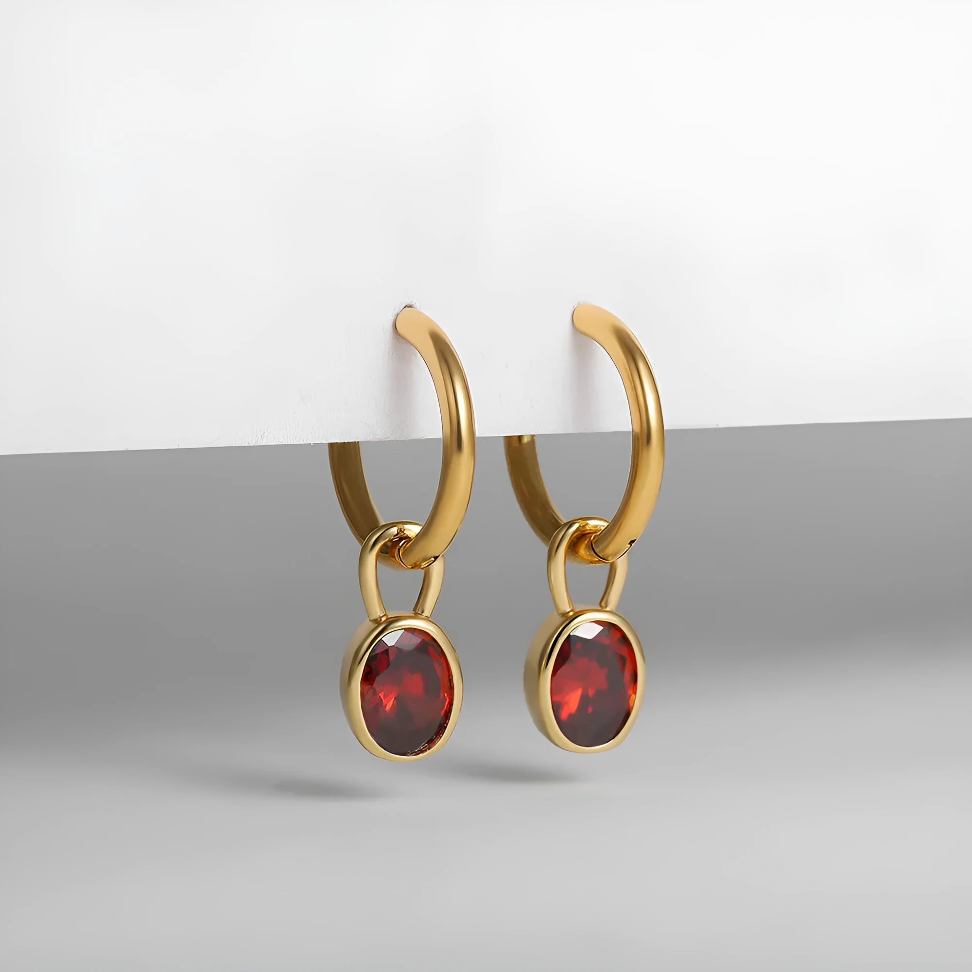 Women's retro-style oval earrings with zircon details on a copper base in six colour options.