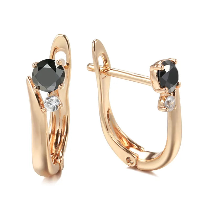 Gold-coloured drop earrings with geometric black agate design and retro styling
