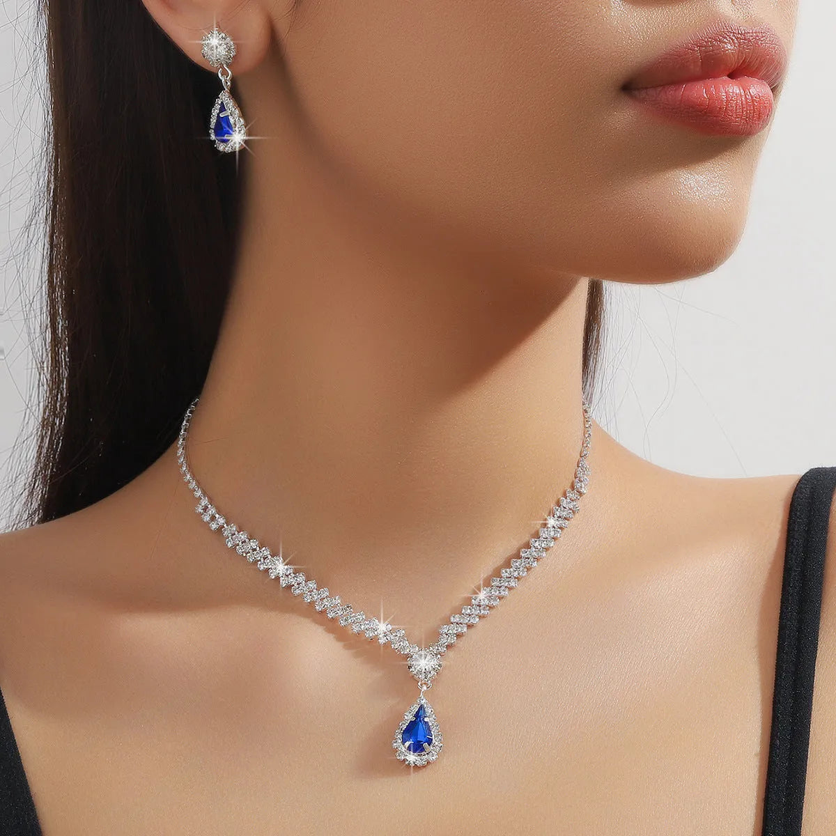 Claw chain necklace and earrings set with drop rhinestones in multiple colour options