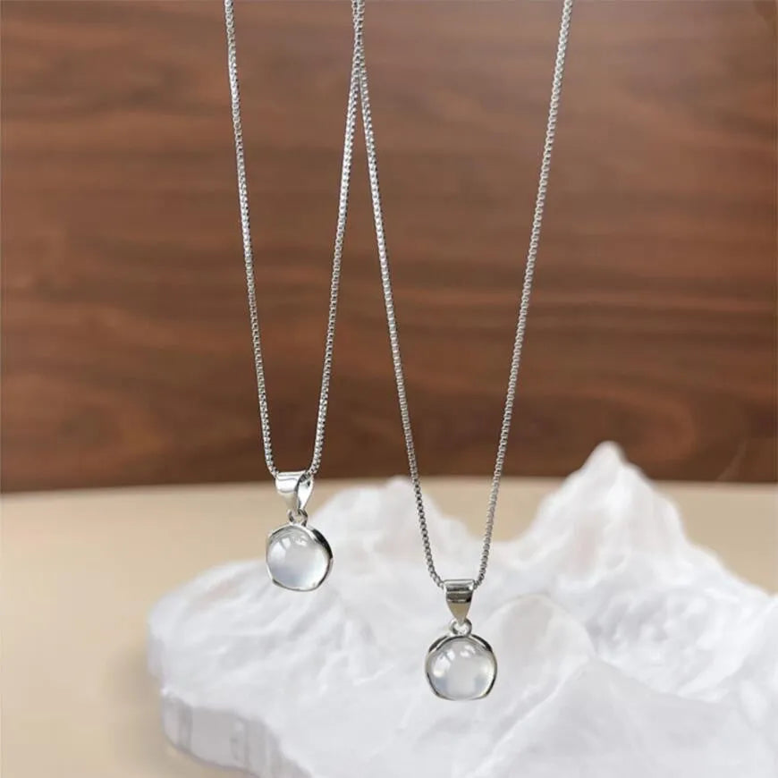 Women's silver-tone adjustable necklace with a clear oval crystal star pendant on a box chain.