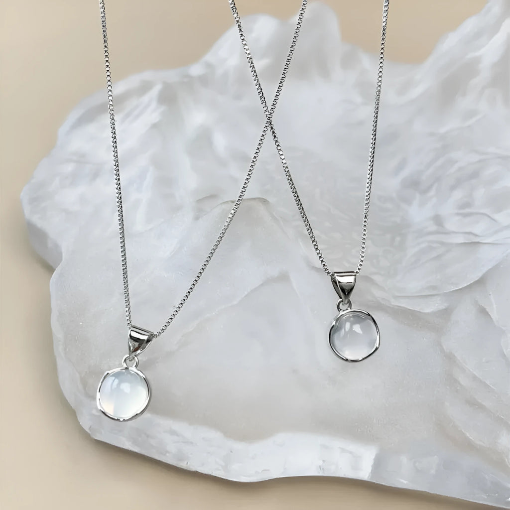 Women's silver-tone adjustable necklace with a clear oval crystal star pendant on a box chain.