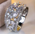 Women's round hollow fashion ring in copper with a choice of gemstone colours on a size chart.