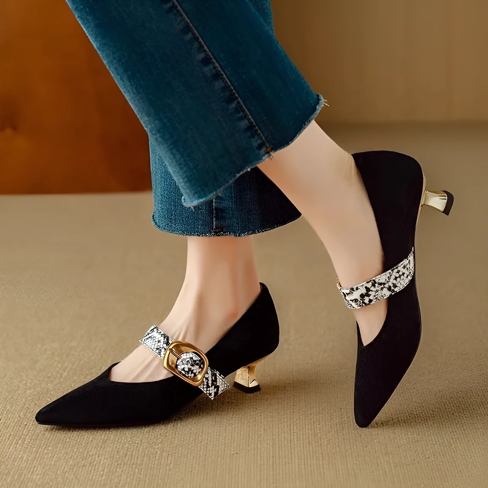 Women's black stiletto heels with buckle fastening and pointed toe design